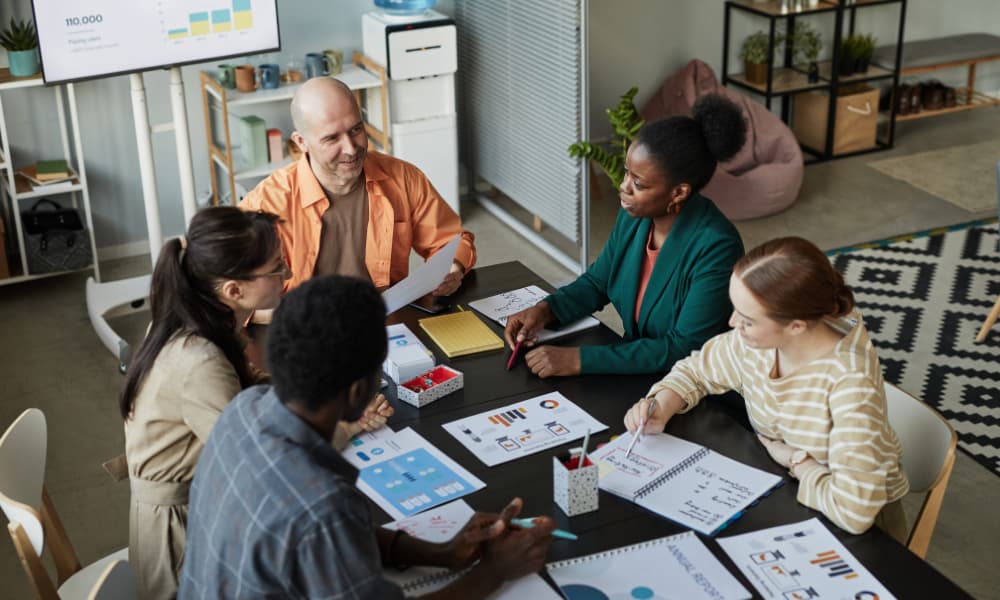 A group of employees working on risk management in the office.