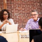 Business owners meeting in a conference room to discuss succession planning