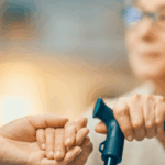 Elderly woman holding someone's hand, symbolizing Social Security benefits and retirement support.