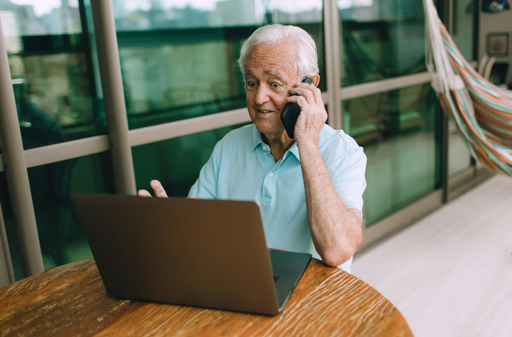 Elder reviewing retirement resolutions together at home, planning for a secure and fulfilling year