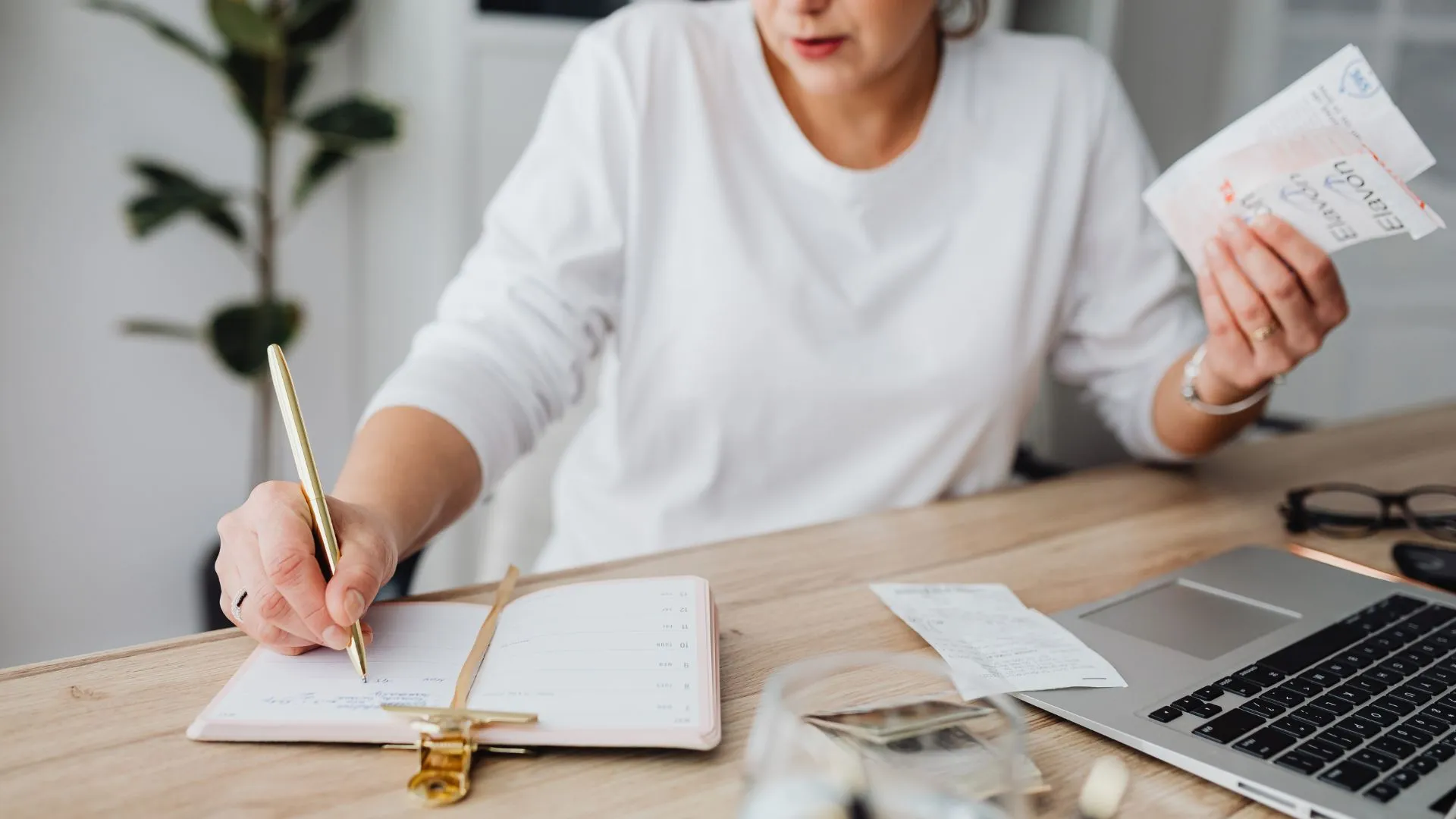 a lady in doing a planning on her desk