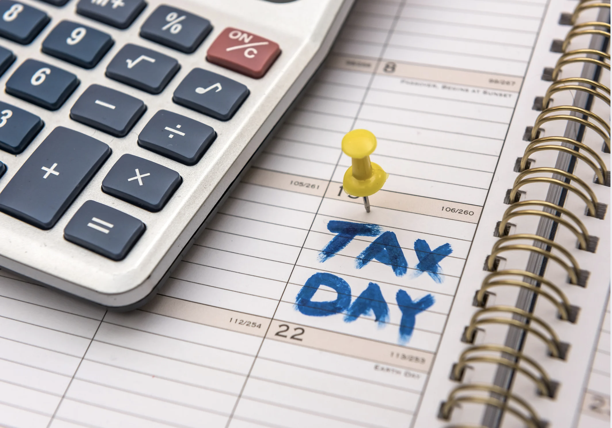 Financial advisor reviewing tax extension options, IRS Form 4868, and filing deadline strategy with a client during tax season.