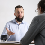 Financial advisor explaining inherited IRA rules, RMD deadlines, and retirement account distribution strategies to a family during tax filing season