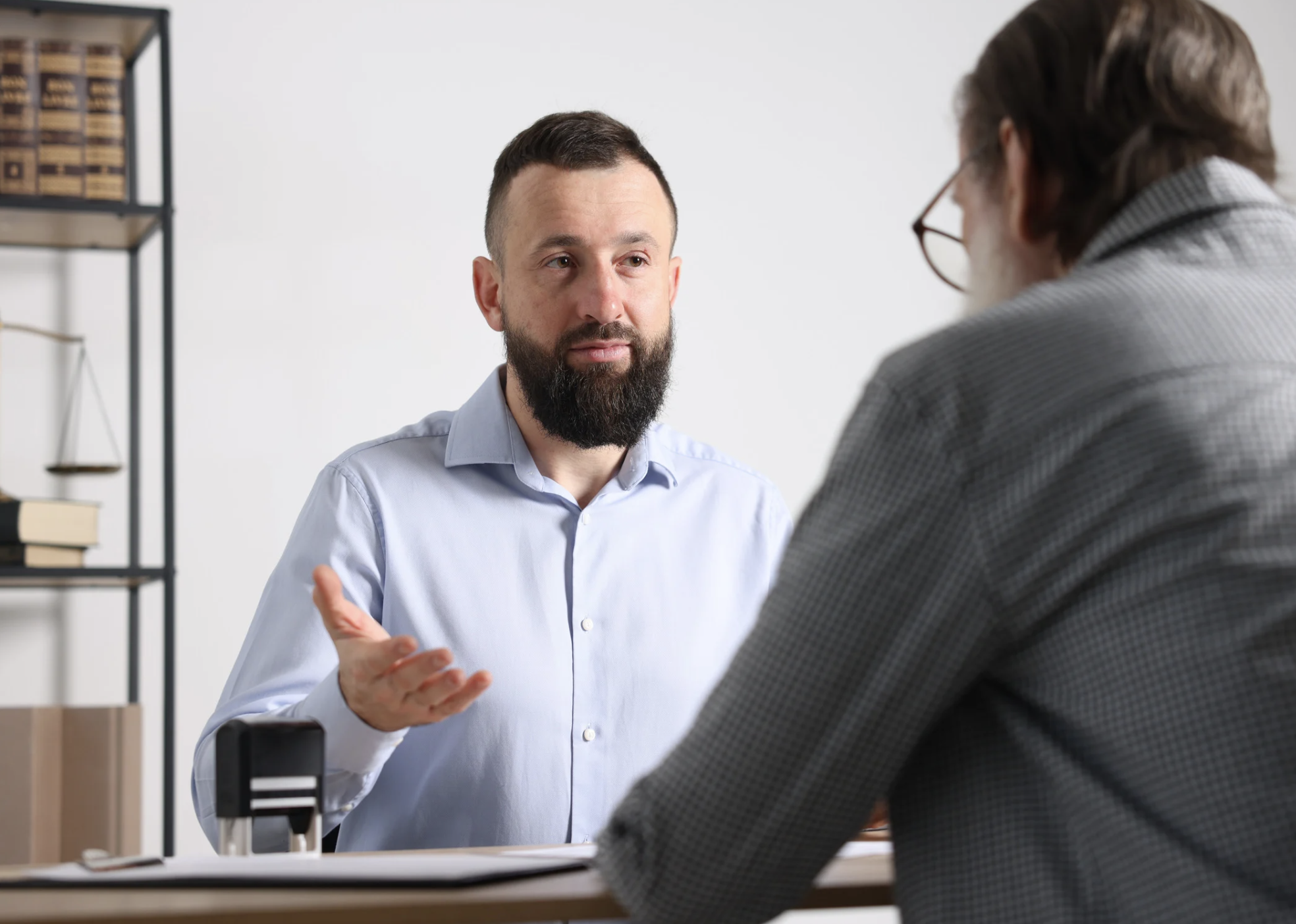 Financial advisor explaining inherited IRA rules, RMD deadlines, and retirement account distribution strategies to a family during tax filing season