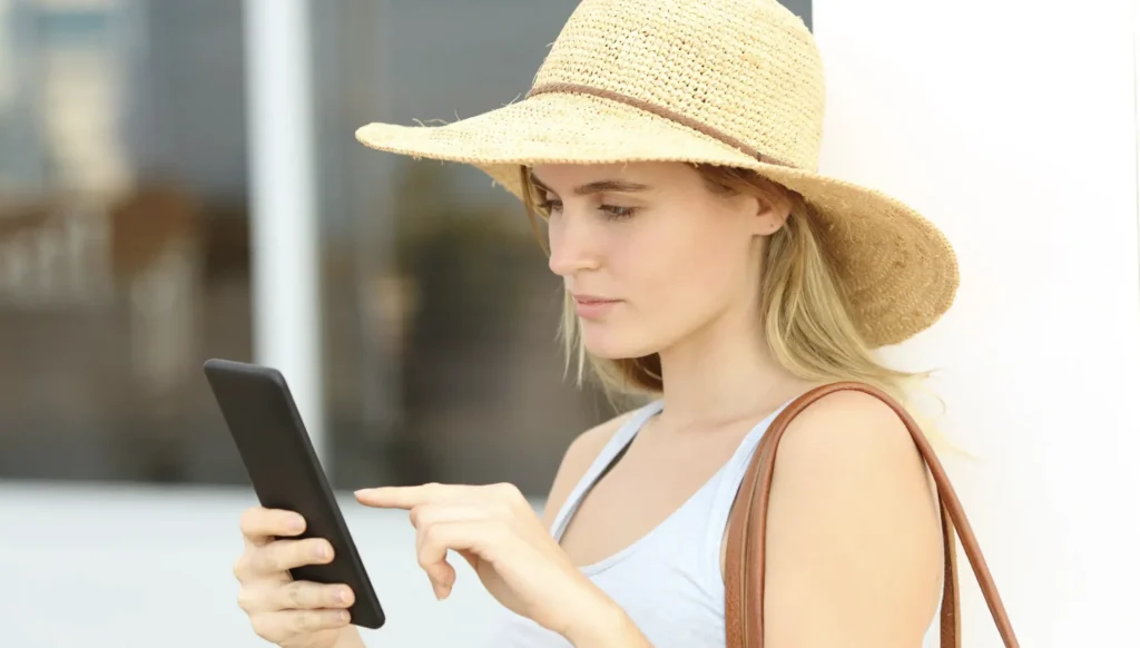 lady with a hot checking her phone