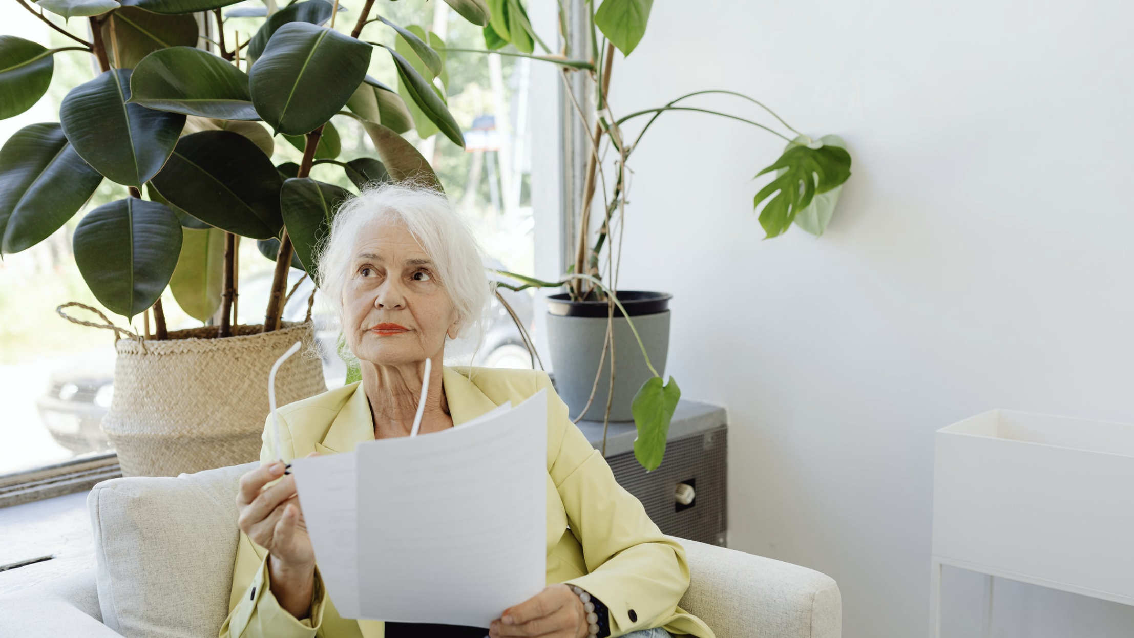 elder woman holding a document