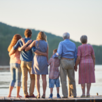a photo of a family facing the sea