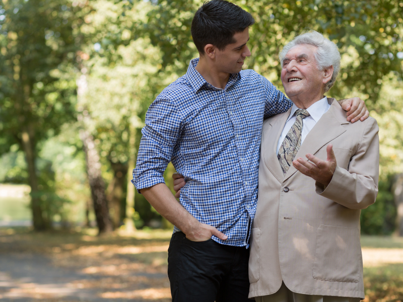 a young men and old men talking